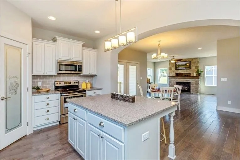 kitchen with island and living room in the background